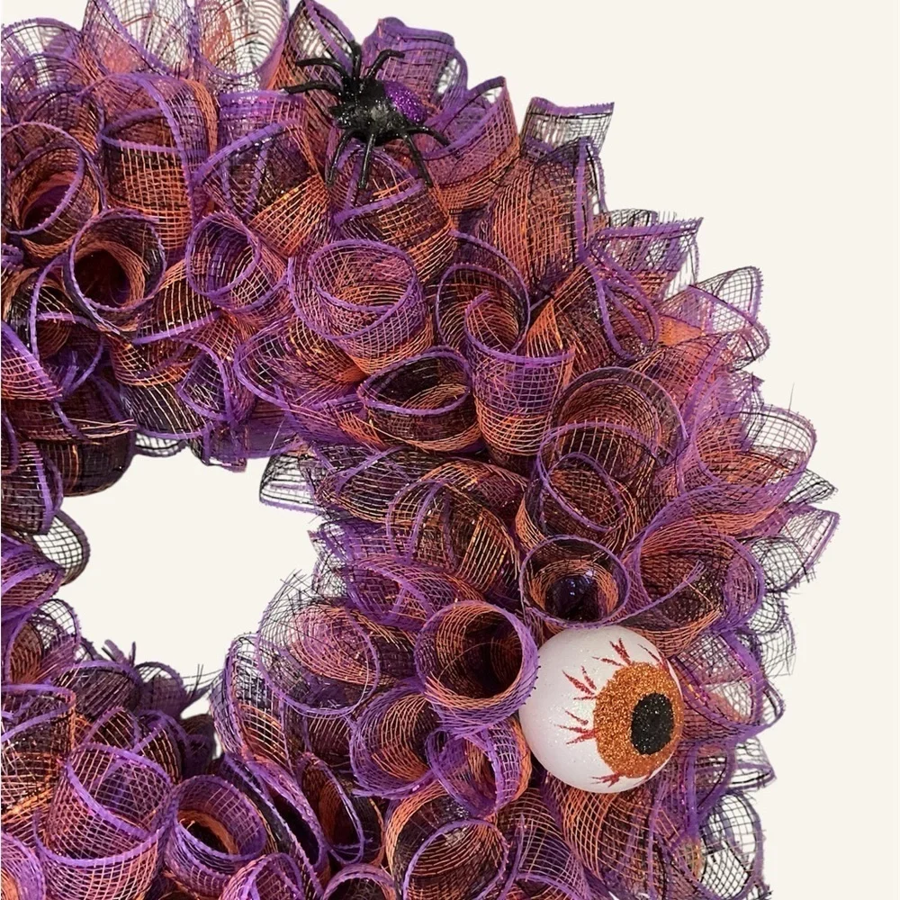 HALLOWEEN WREATH WITH PURPLE AND ORANGE ADORNED WITH FLOWERS AND SKULL HAND MADE